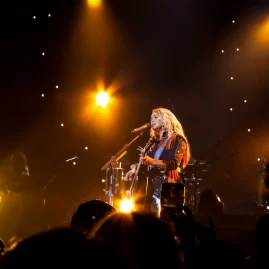 Miranda lambert on stage at a distance during her Velvet Rodeo Las Vegas Residency, with the audience in the foreground. 4/2/2023 | Photo by Miranda Mendelson, LiveMusicDiary.com